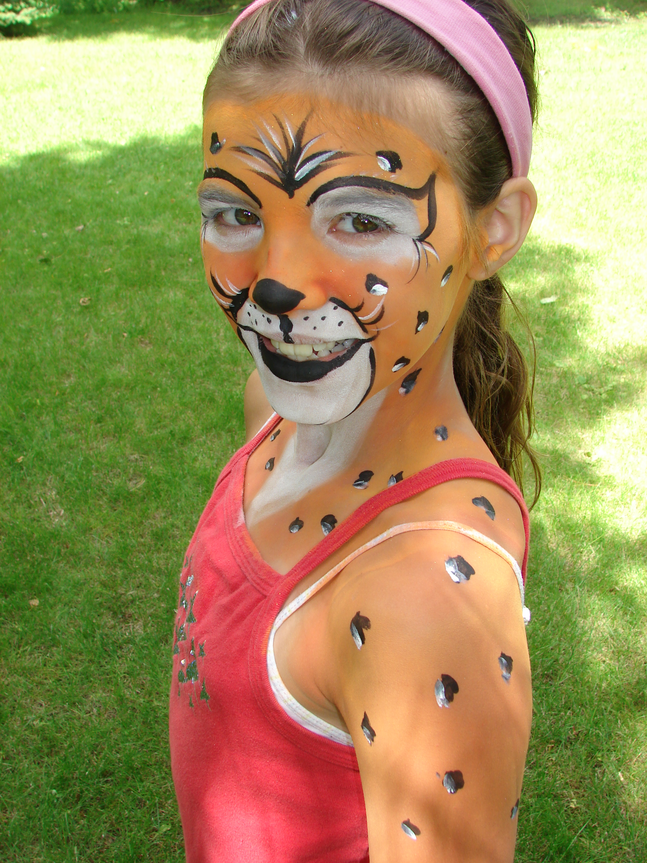 Cheetah face and body paint.